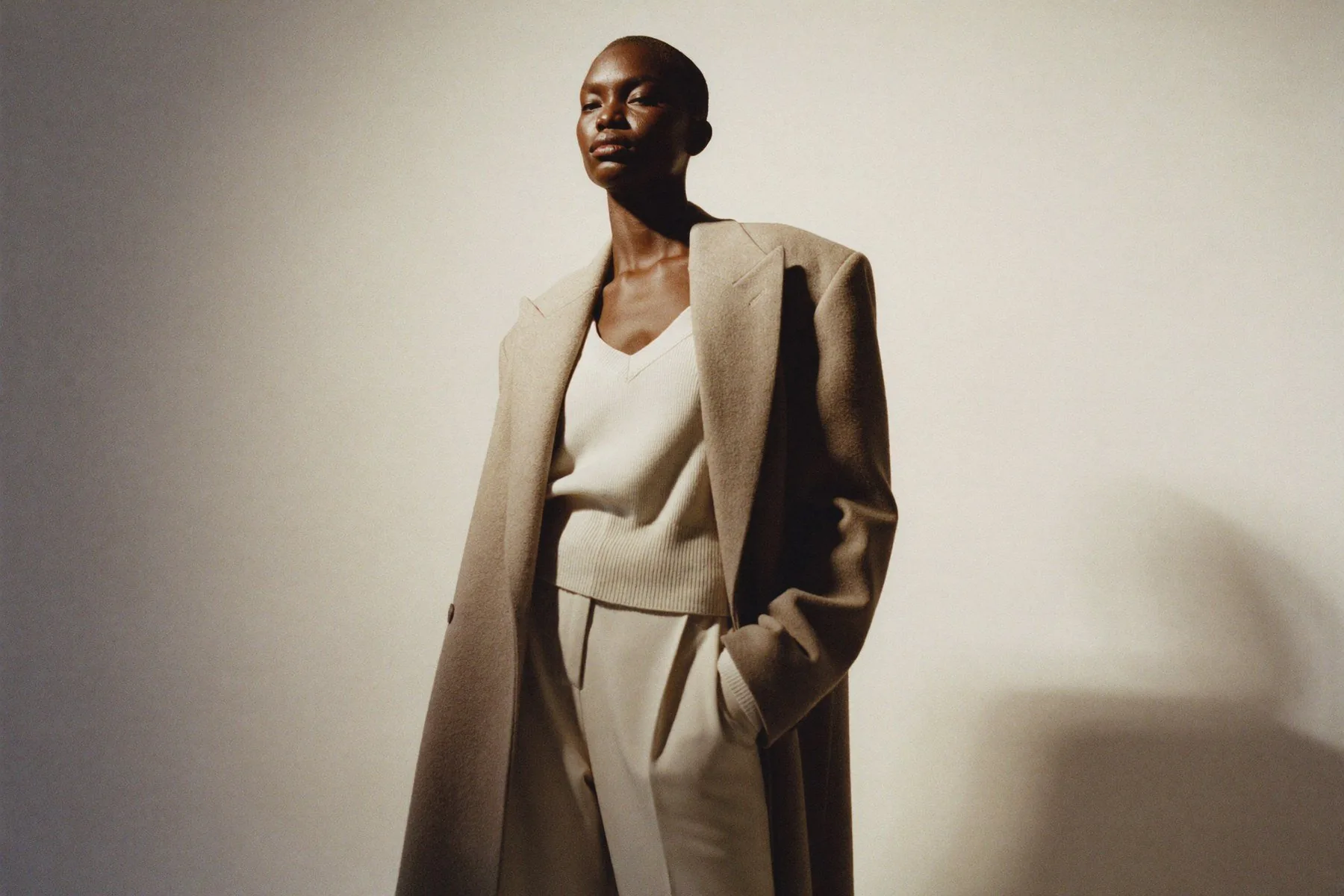 On-model editorial, long tailored coat on a consistent model